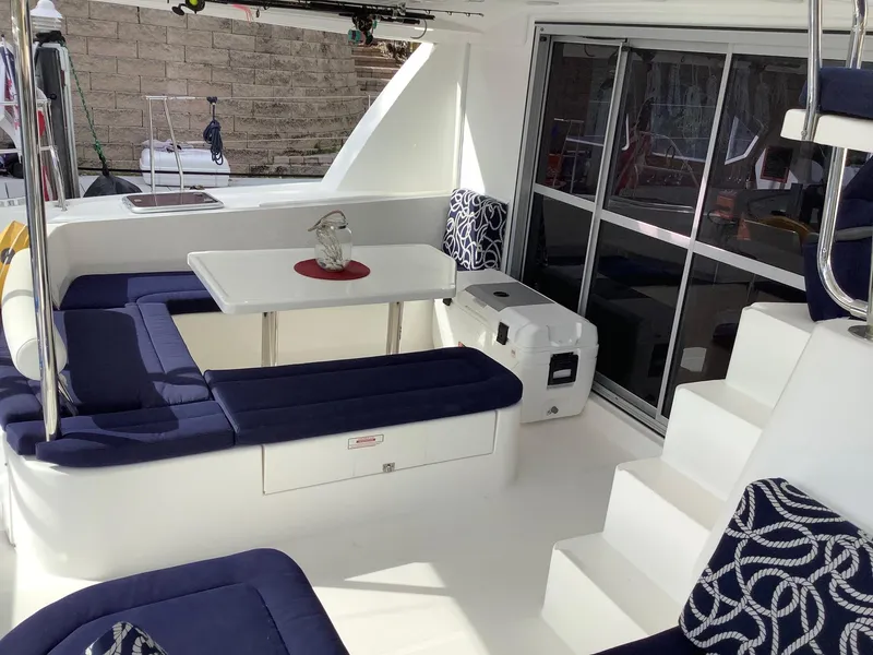 Slide: The Image of Luxurious 2013 Leopard 44 yacht interior with blue seating and dining area. - 12