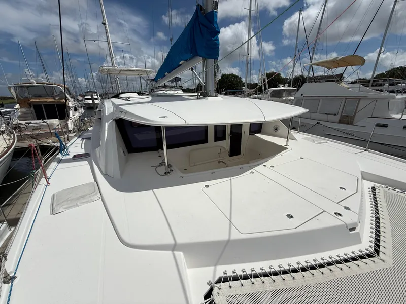 Slide: The Image of 2013 Leopard 44 catamaran docked at marina under blue sky. - 18