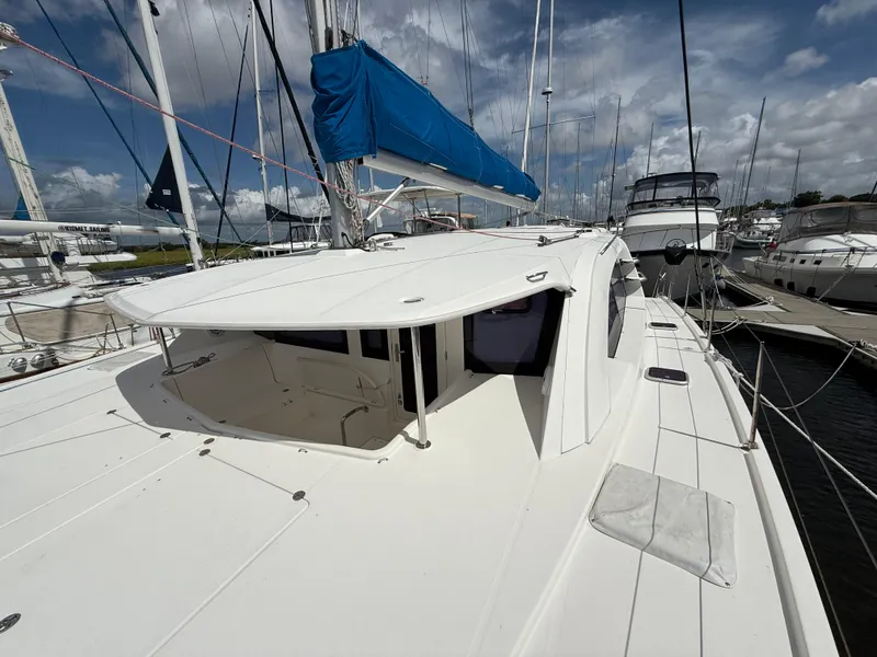 Slide: The Image of 2013 Leopard 44 catamaran docked at marina under cloudy sky. - 19