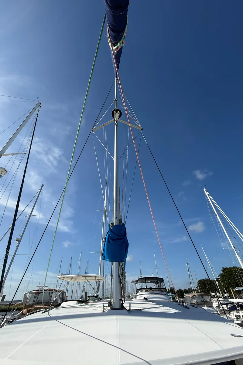 Slide: The Image of 2013 Leopard 44 sailboat mast and rigging under clear blue sky. - 27