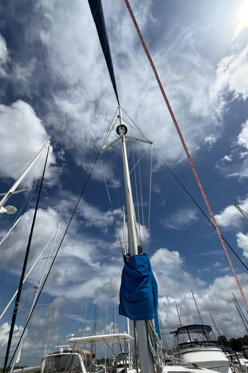 Slide: The Image of Sailboat mast against a cloudy sky, Leopard 44 model, 2013. - 28