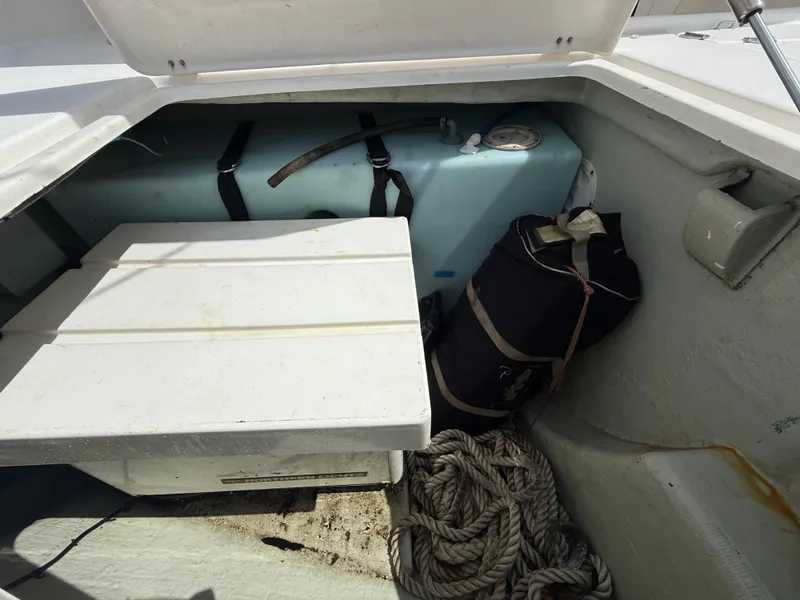 Slide: The Image of Storage compartment of a 2013 Leopard 44 boat with ropes and equipment. - 31