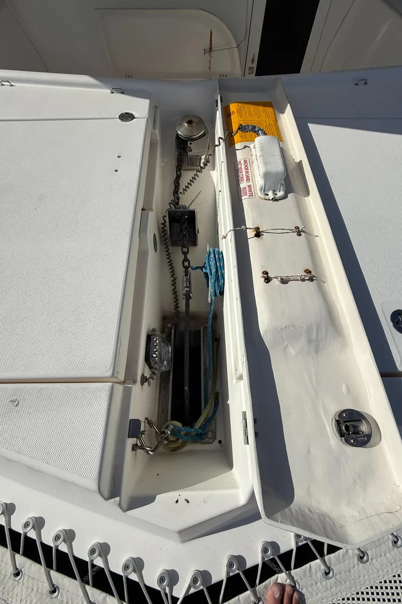 Slide: The Image of Anchor locker on a 2013 Leopard 44 catamaran, featuring ropes and safety equipment. - 33