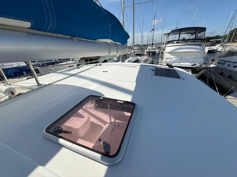 Slide: The Image of 2013 Leopard 44 catamaran deck with hatch, docked in a marina. - 34