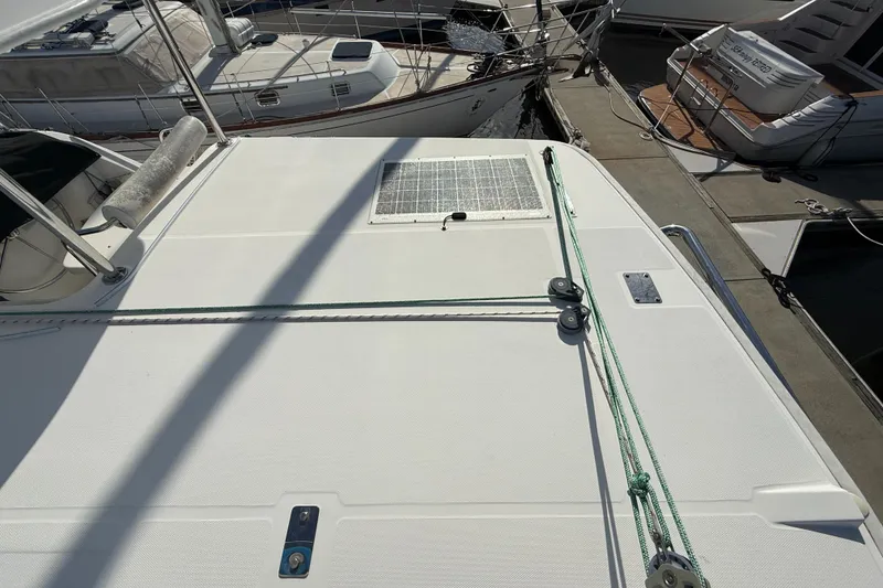 Slide: The Image of Deck of 2013 Leopard 44 catamaran with solar panel and mooring lines at marina. - 35