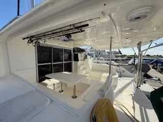 Slide: The Image of 2013 Leopard 44 yacht deck with seating and table, docked at marina. - 39