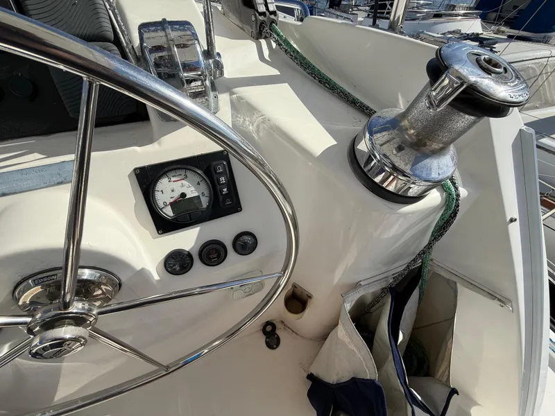 Slide: The Image of Steering wheel and controls on a 2013 Leopard 44 sailboat deck. - 47