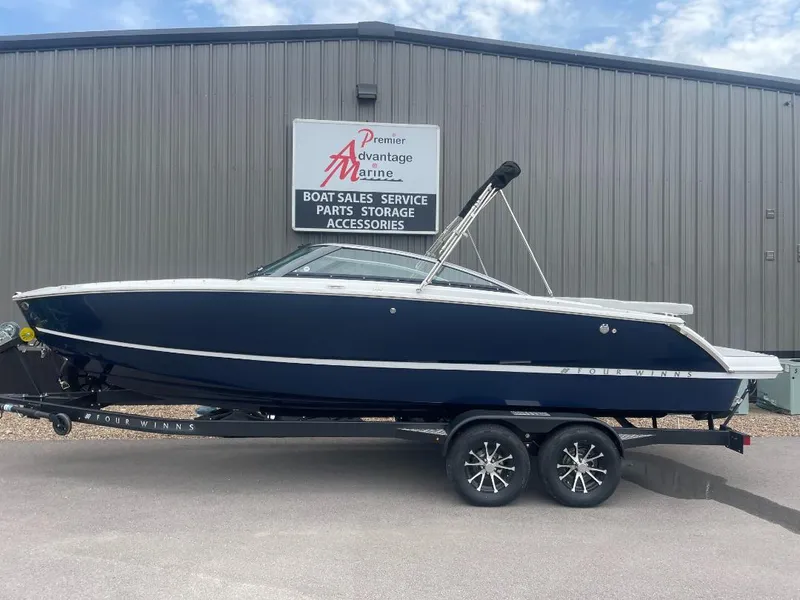 The Image of 2025 Four Winns H4 Freedom boat on trailer at dealership. - 1