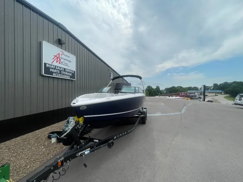 Slide: The Image of 2025 Four Winns H4 Freedom boat on trailer at dealership. - 3