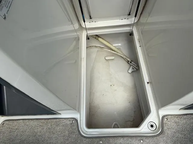 Slide: The Image of Storage compartment of a 2001 Chris-Craft Launch 25 boat, featuring clean interior space. - 19