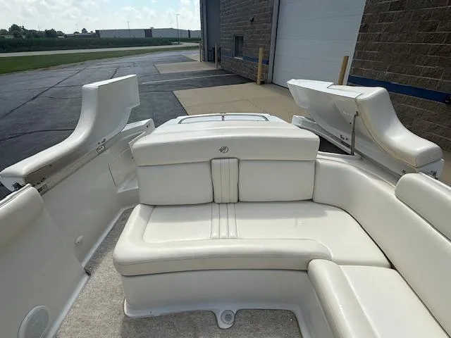 Slide: The Image of 2001 Chris-Craft Launch 25 boat interior with white seating and open deck view. - 23