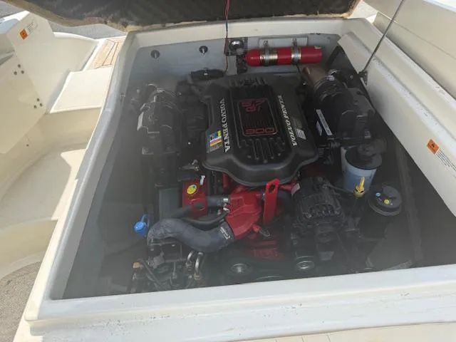 Slide: The Image of Engine compartment of a 2001 Chris-Craft Launch 25 boat, featuring a Volvo Penta engine. - 29