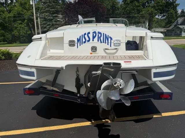 Slide: The Image of 2001 Chris-Craft Launch 25 boat named "Miss Print" on a trailer, rear view. - 3