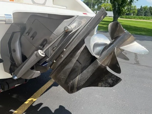 Slide: The Image of 2001 Chris-Craft Launch 25 boat propeller and stern drive on pavement. - 37