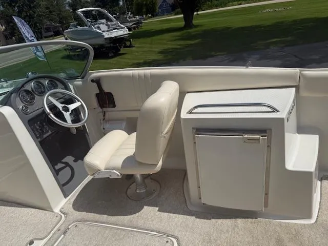 Slide: The Image of 2001 Chris-Craft Launch 25 boat interior with steering wheel and seating. - 5