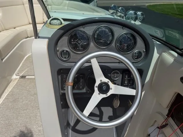 Slide: The Image of 2001 Chris-Craft Launch 25 dashboard with steering wheel and gauges. - 6