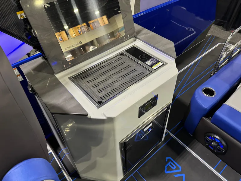 Slide: The Image of Modern Paradigm 236 boat interior with sleek grill and storage, 2025 model. - 11