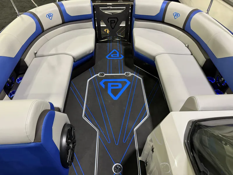 Slide: The Image of Luxurious Paradigm 236 boat interior, 2025 model, featuring blue and gray seating. - 7