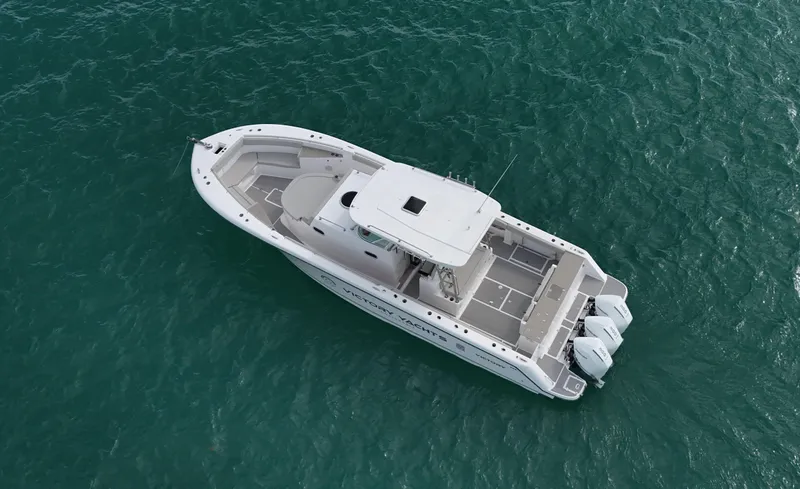 Slide: The Image of 2024 Victory V400 Open Sea boat on turquoise water, aerial view. - 1