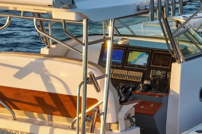 Slide: The Image of 2024 Victory V400 Open Sea boat cockpit with navigation screens and controls. - 15