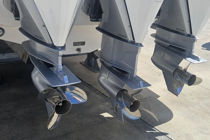Slide: The Image of Triple outboard motors on a 2024 Victory Yachts V400 Open Sea. - 18