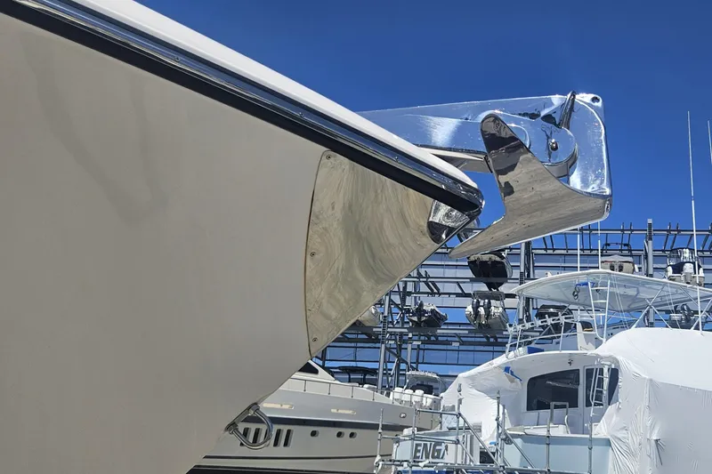 Slide: The Image of 2024 Victory Yachts V400 Open Sea bow with anchor, docked under clear blue sky. - 21