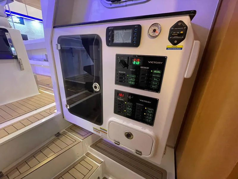 Slide: The Image of Control panel of 2024 Victory V400 Open Sea boat with digital displays and gauges. - 5