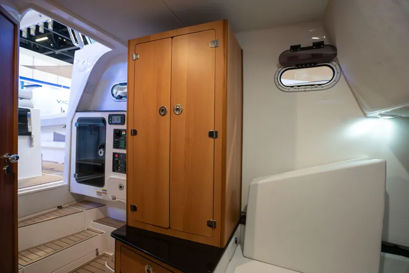 Slide: The Image of Interior of 2024 Victory V400 Open Sea boat with wooden cabinetry and modern design. - 8