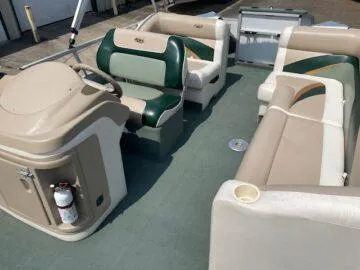 Slide: The Image of 1999 Princecraft Sportfisher 20 boat interior with beige and green seating. - 5