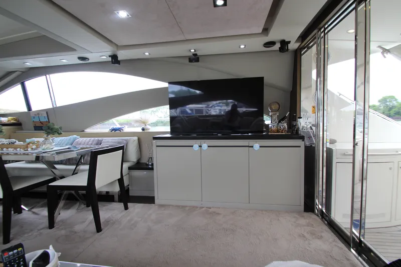 Slide: The Image of Luxurious interior of 2007 Uniesse 70 Sport yacht with modern furnishings and large TV. - 10
