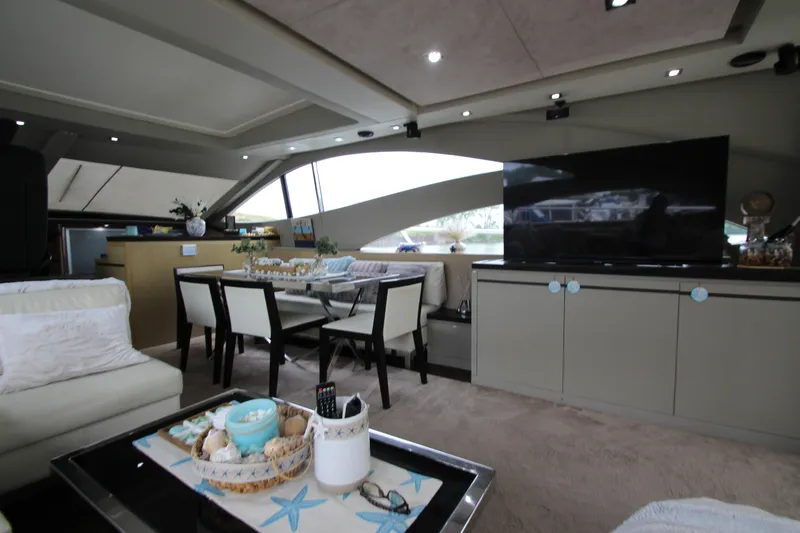 Slide: The Image of Luxurious interior of 2007 Uniesse 70 Sport yacht with modern dining and living area. - 11