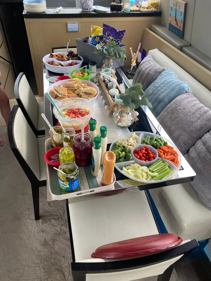 Slide: The Image of Buffet spread on Uniesse 70 Sport yacht, featuring snacks and condiments, 2007 model. - 12