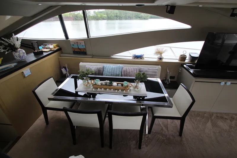 Slide: The Image of Luxurious interior of 2007 Uniesse 70 Sport yacht with elegant dining area. - 13