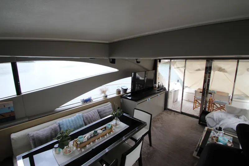 Slide: The Image of Luxurious interior of 2007 Uniesse 70 Sport yacht with modern furnishings and large windows. - 15