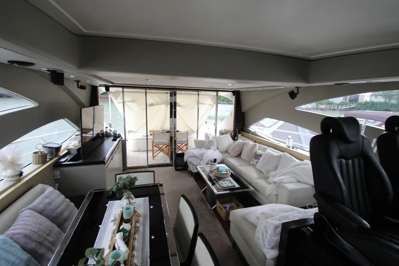 Slide: The Image of Luxurious interior of 2007 Uniesse 70 Sport yacht with modern seating and decor. - 16