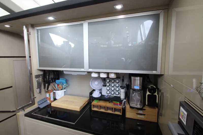 Slide: The Image of Modern kitchen in 2007 Uniesse 70 Sport yacht with sleek cabinetry and appliances. - 22