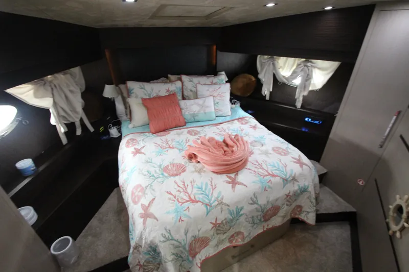 Slide: The Image of Luxurious bedroom in 2007 Uniesse 70 Sport yacht with nautical-themed bedding. - 31