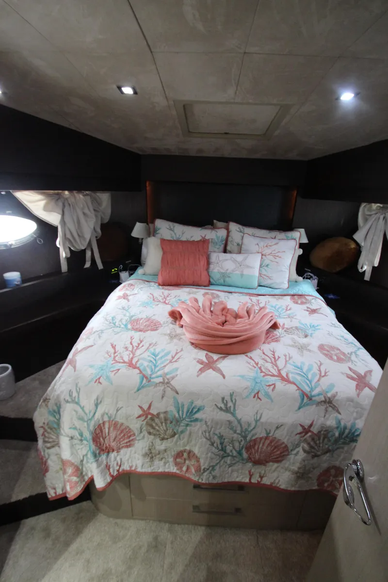 Slide: The Image of Luxurious bedroom in 2007 Uniesse 70 Sport yacht with coral-themed bedding. - 35