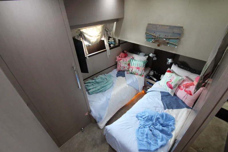 Slide: The Image of Cozy twin bedroom in 2007 Uniesse 70 Sport yacht with colorful decor. - 40