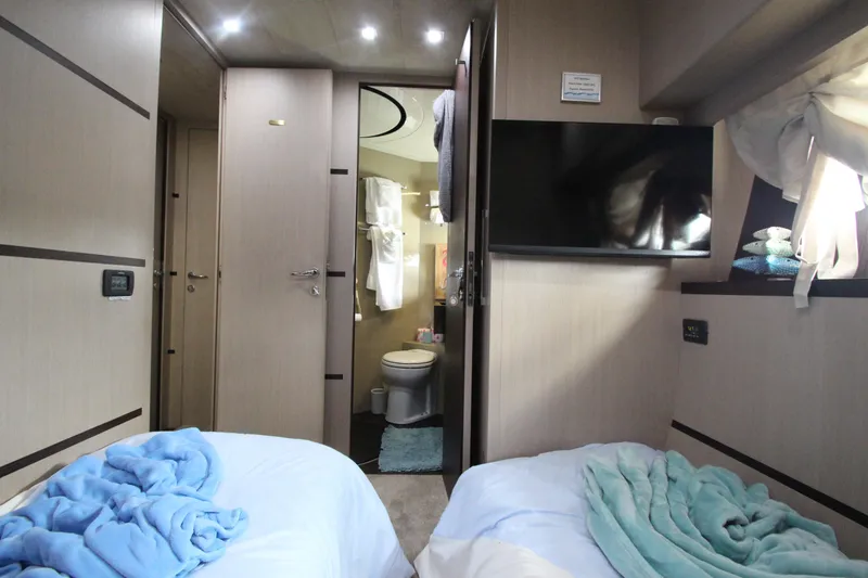 Slide: The Image of Interior of 2007 Uniesse 70 Sport yacht with twin beds and modern amenities. - 44