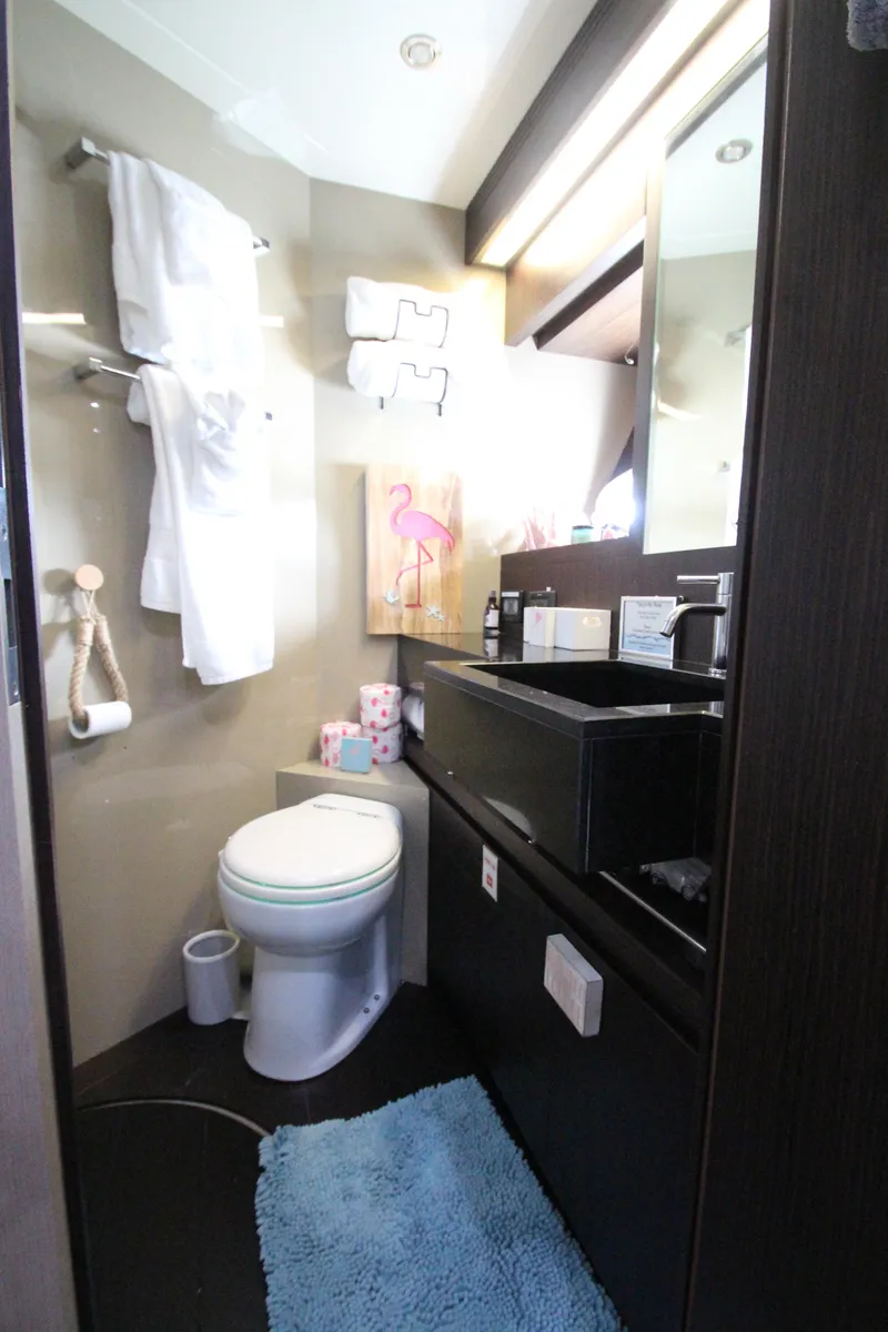 Slide: The Image of Luxury bathroom in 2007 Uniesse 70 Sport yacht with modern fixtures and decor. - 48