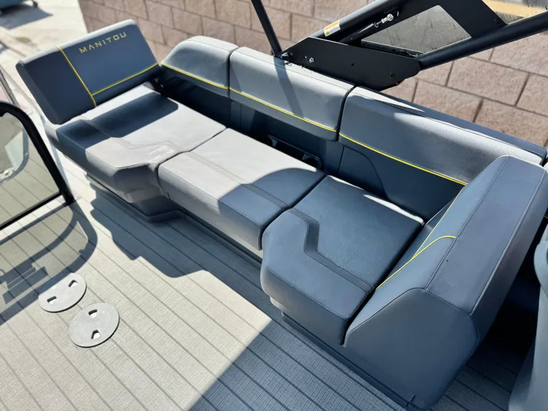 Slide: The Image of Luxurious seating on 2024 Manitou Explore 24 Navigator boat, featuring sleek design and comfort. - 17