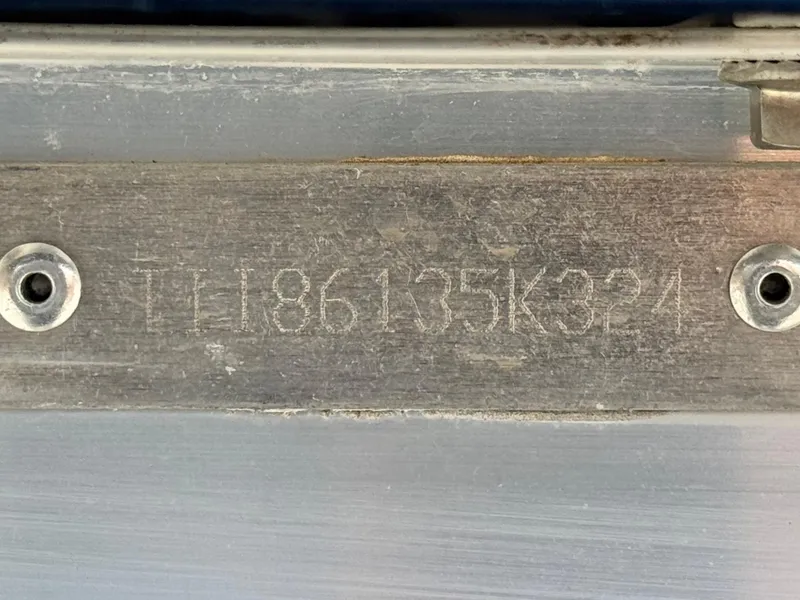 Slide: The Image of 2024 Manitou Explore 24 Navigator serial number plate with engraved code. - 27