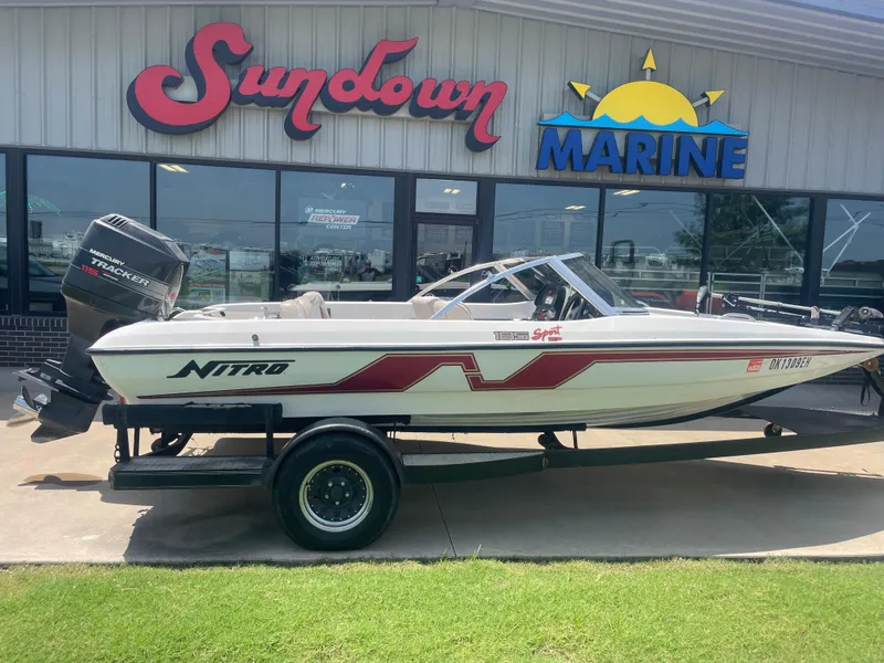 The Image of 1995 Nitro 185SF boat on trailer outside Sundown Marine dealership. - 1