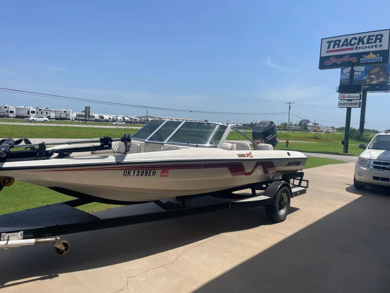 Slide: The Image of 1995 Nitro 185SF boat on trailer at Tracker Boats dealership. - 3