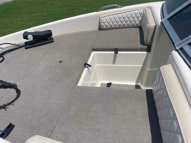 Slide: The Image of 1995 Nitro 185SF boat interior with cushioned seating and storage compartment. - 5