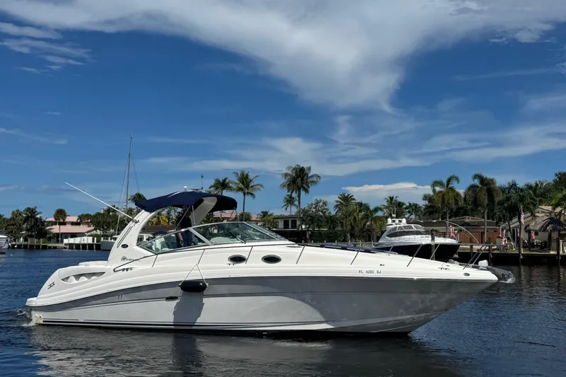Slide: The Image of 2004 Sea Ray 340 Sundancer docked, displaying "Grande Affare" name, Fort Lauderdale, Florida. - 2