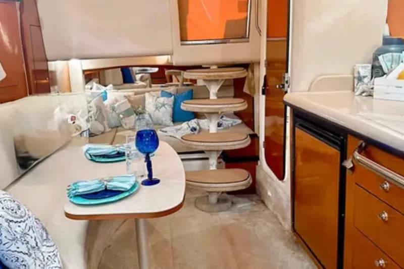 Slide: The Image of Luxurious interior of 2004 Sea Ray 340 Sundancer yacht with elegant kitchen setup. - 20