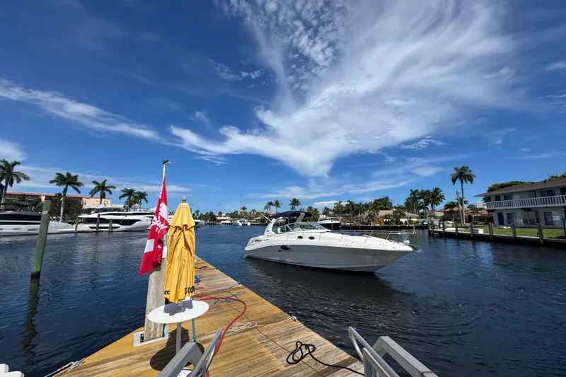 Slide: The Image of Luxurious 2004 Sea Ray 340 Sundancer yacht interior with elegant kitchen and wine setup. - 24