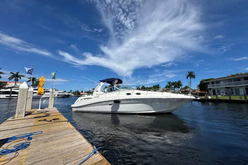 Slide: The Image of Luxurious interior of 2004 Sea Ray 340 Sundancer yacht with elegant seating and decor. - 25